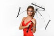 Photo: Portrait of young woman with umbrella Portrait of young woman with umbrella