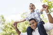 Hispanic Father and Son Having Fun in the Park