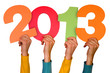 hands with numbers shows year 2013