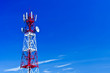Telecommunications tower, painted white and red in a day of clea