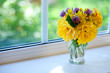 beautiful bouquet of roses on a window sill