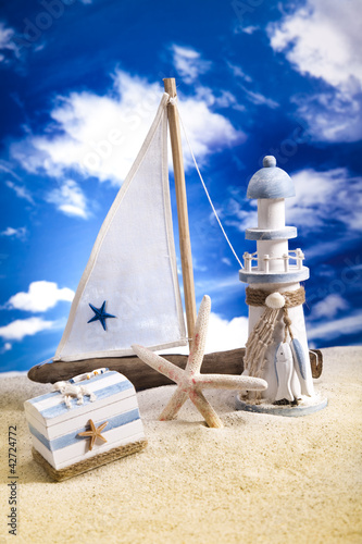 Photo: Summer Beach, Sailboat, Lighthouse concept Summer Beach, Sailboat, Lighthouse concept