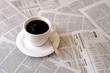 coffee over newspaper