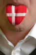 man tongue painted in denmark flag symbolizing to knowledge to s