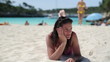 Portrait of smiling female friends lying on the beach