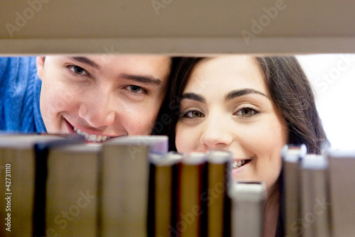 Photo: Students hiding at the library Students hiding at the library