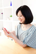 a young asian woman using smart phone