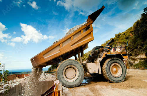 Photo: bulldozer excavator in quarry bulldozer excavator in quarry