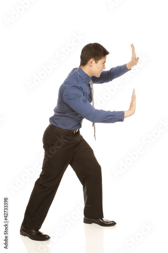 Photo: Employee Pushing Isolated Employee Pushing Isolated