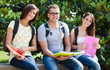 Group of smiling students sitting on a bench
