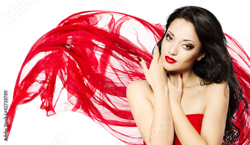 Photo: Beautiful woman portrait in red and waving scarf Beautiful woman portrait in red and waving scarf