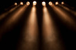 Eight divergent spotlights at night