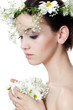 Portrait of the beautiful girl with flowers in hair