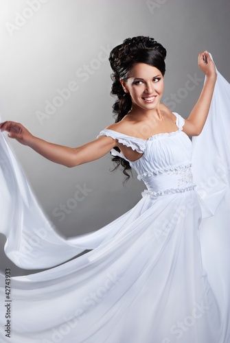 Photo: Fiance and the wind. Woman in a wedding dress Fiance and the wind. Woman in a wedding dress
