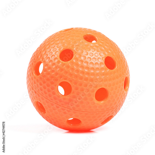 Photo: orange floorball ball isolated on white background orange floorball ball isolated on white background