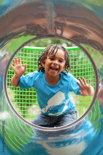 Photo: Portrait of a cute african little boy at playground Portrait of a cute african little boy at playground