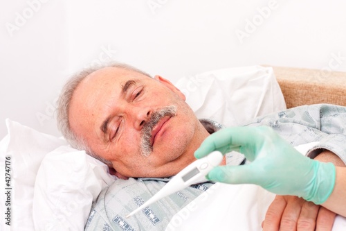 Photo: Senior man with fever Senior man with fever