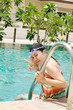 Close up woman swimming in swimming pool.