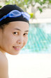 Close up woman swimming in swimming pool.