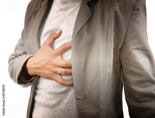 Photo: Businessman Suffering From Heart Attack. Businessman Suffering From Heart Attack.