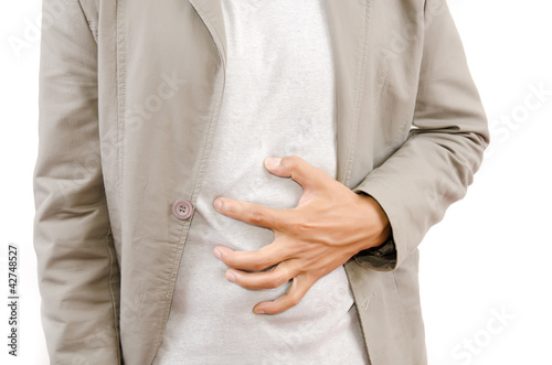 Photo: Businessman Suffering From Abdominal Pain. Businessman Suffering From Abdominal Pain.