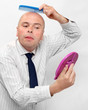 Hairless businessman with mirror - forever beautiful.