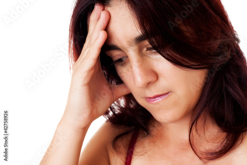 Photo: Portrait of a stressed hispanic woman with a headache Portrait of a stressed hispanic woman with a headache