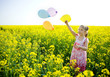 Girl with Balloons on a yellow field