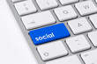 Keyboard with single blue button showing the word social