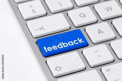 Photo: Keyboard with one blue button with the word feedback Keyboard with one blue button with the word feedback