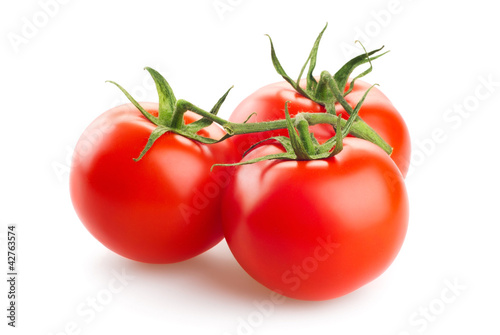 Photo: three fresh tomatoes with green leaves isolated on white backgro three fresh tomatoes with green leaves isolated on white backgro