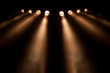 Eight divergent spotlights at night