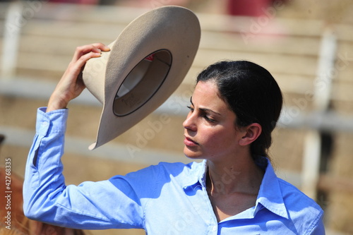 Photo: Portrait of young cowgirl Portrait of young cowgirl