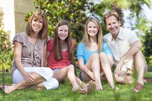 Photo: Parents Children Family Healthy Sitting In Garden Parents Children Family Healthy Sitting In Garden