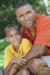 Happy African American Father and Son Family Outside