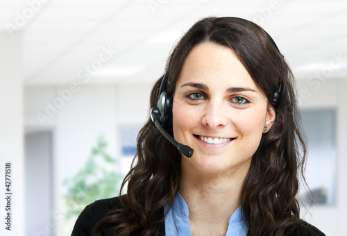Photo: Beautiful customer representative at work Beautiful customer representative at work