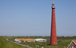 dutch lighthouse with blue sky