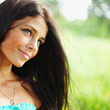 Beautiful Healthy Woman over Nature background