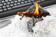 Photo: Burning Rejected Business Plan on the Office Background Burning Rejected Business Plan on the Office Background