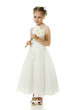 Beautiful girl in white dress with a flower