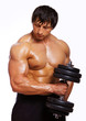 Portrait of muscle man doing exercises with dumbbells
