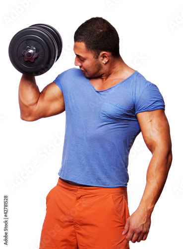 Photo: Portrait of muscle man on white background with dumbbels Portrait of muscle man on white background with dumbbels