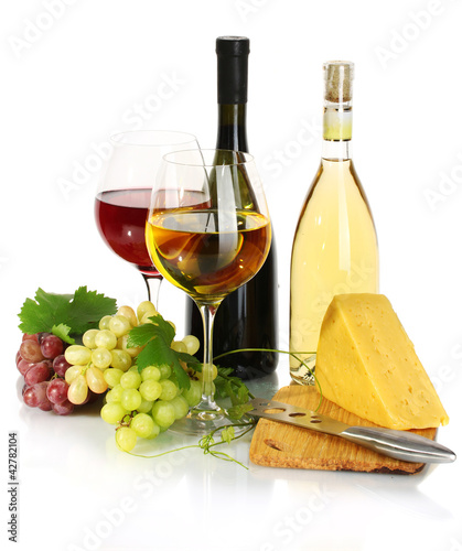 Photo: bottles and glasses of wine, cheese and ripe grapes isolated bottles and glasses of wine, cheese and ripe grapes isolated