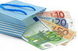 euronoten in einkaufstasche