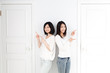 a young asian women with 2 doors