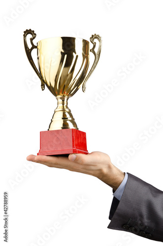 Foto: Man being awarded with golden cup Man being awarded with golden cup