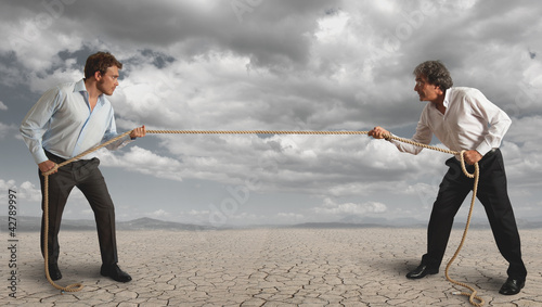 Foto: Businessman and pull the rope Businessman and pull the rope