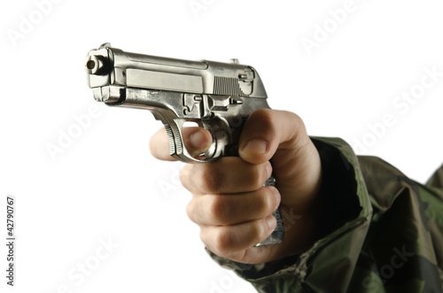 Photo: Gun in the hand on white Gun in the hand on white