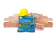Construction concept with helmet and toolkit