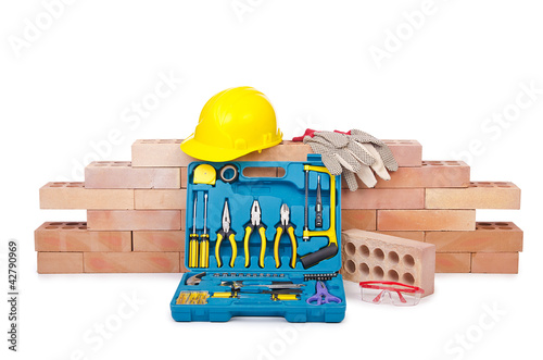 Photo: Construction concept with helmet and toolkit Construction concept with helmet and toolkit